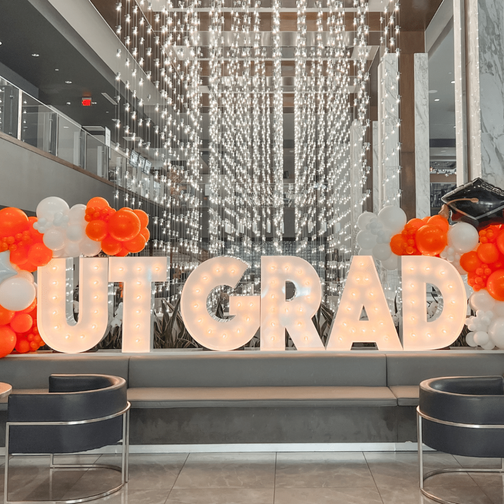 Light Letters reading "UT Grad"