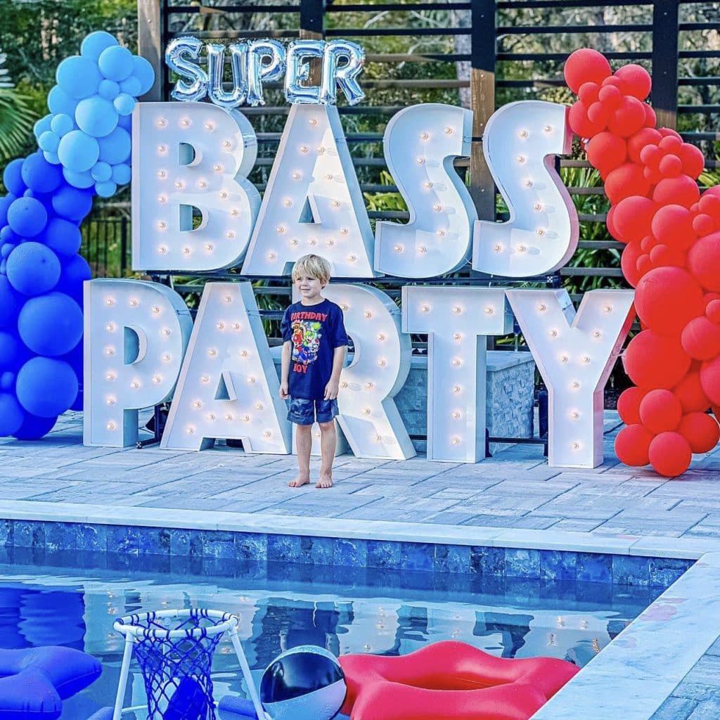 Light-Up Marquee Letters spelling out BASS PARTY with a balloon display