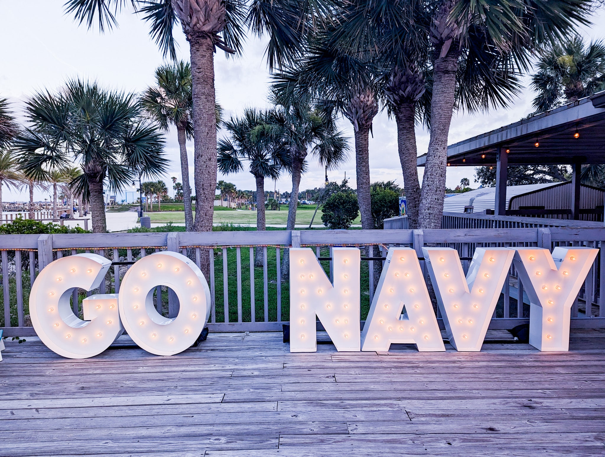 Light-Up Marquee Letters spelling out GO NAVY on a pier in Florida