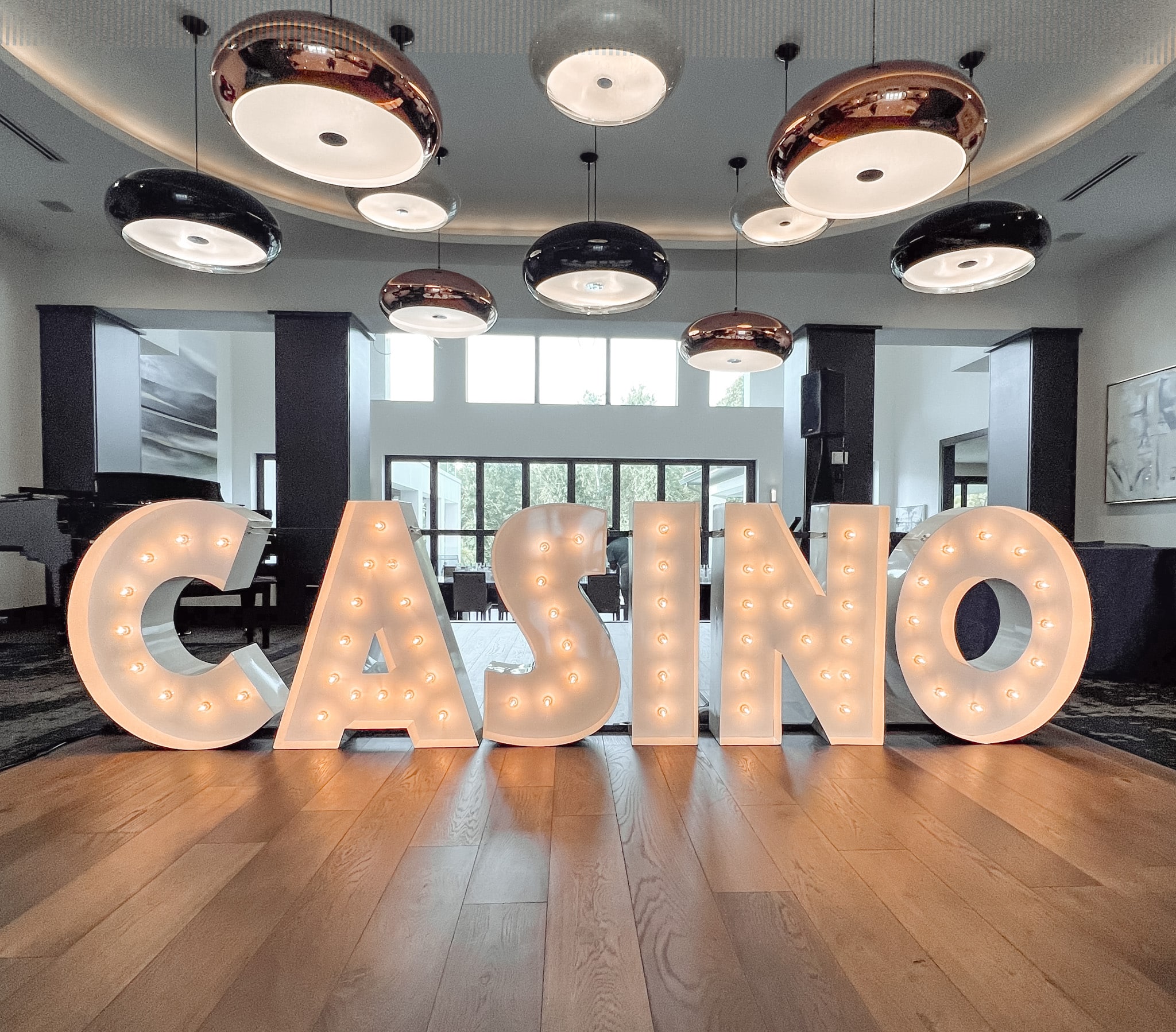 Light-Up Marquee Letters spelling out CASINO beneath modern lighting