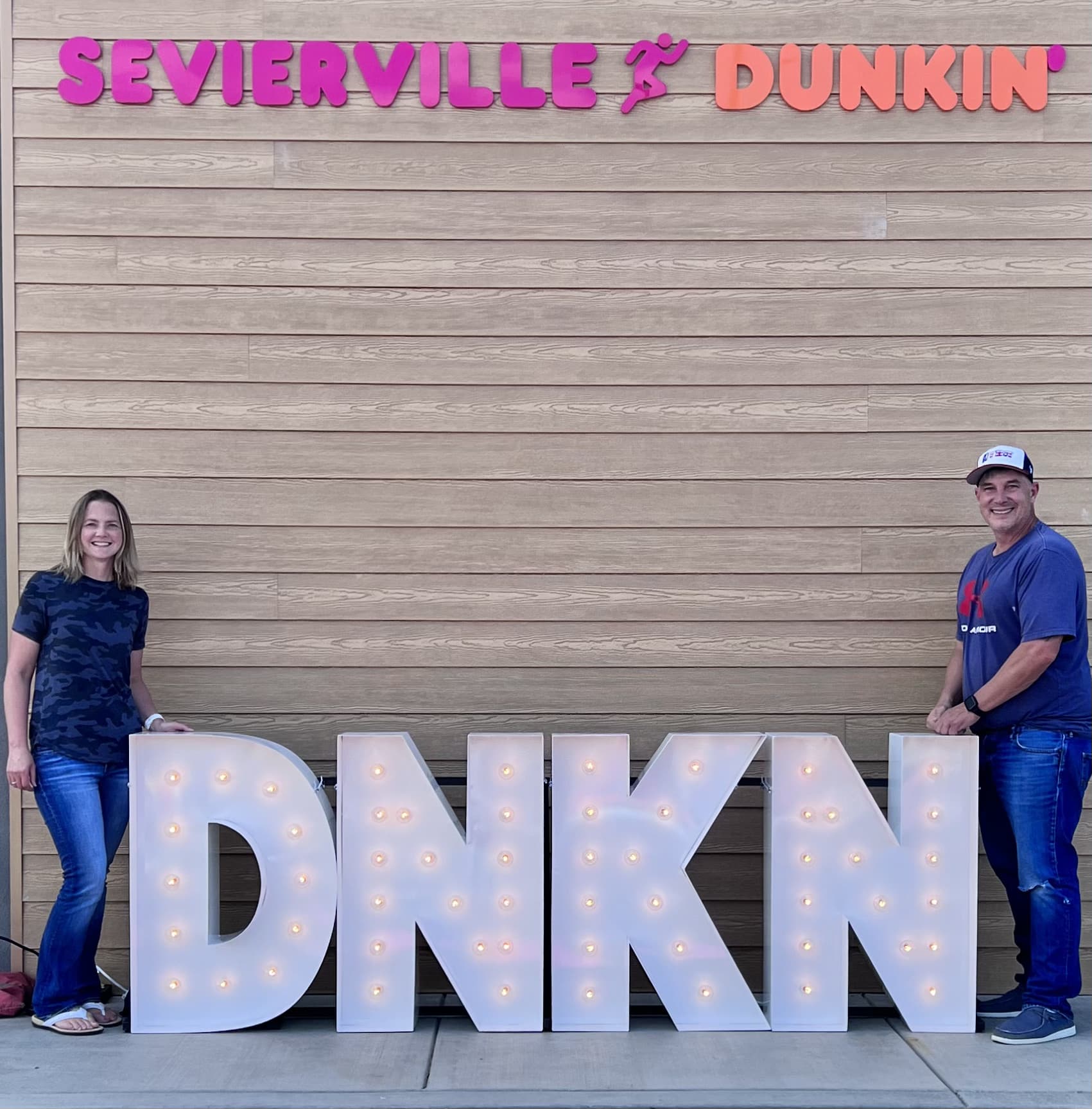 DNKN spelled out in front of a Dunkin Donuts